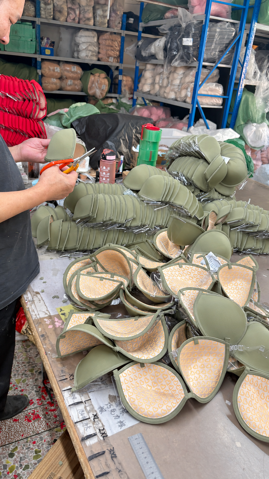 Manual finishing of underwear cup components in the factory